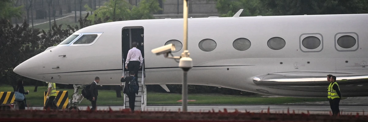 Tesla CEO Elon Musk boards his private jet before departing from Beijing Capital International Airport on May 31, 2023.