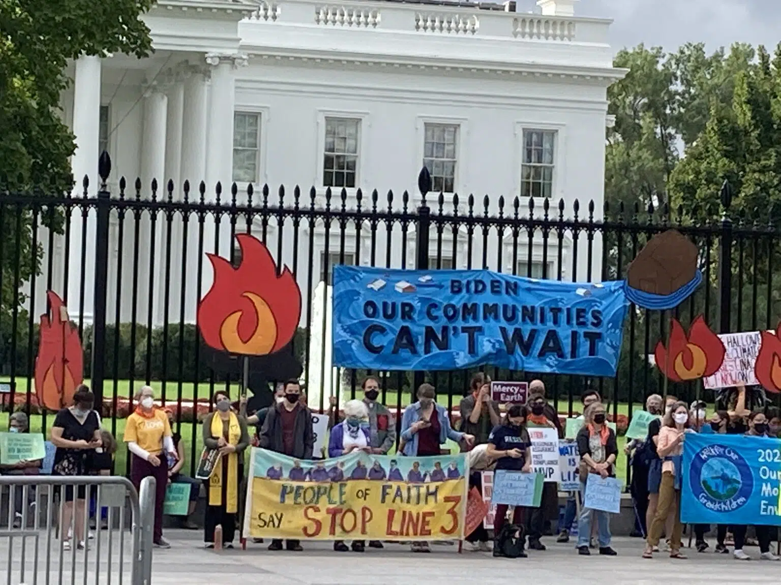 Climate activists assembled at the White House during the People vs Fossil Fuels week of direct action in Oct. 2021. Credit: Dana Drugmand