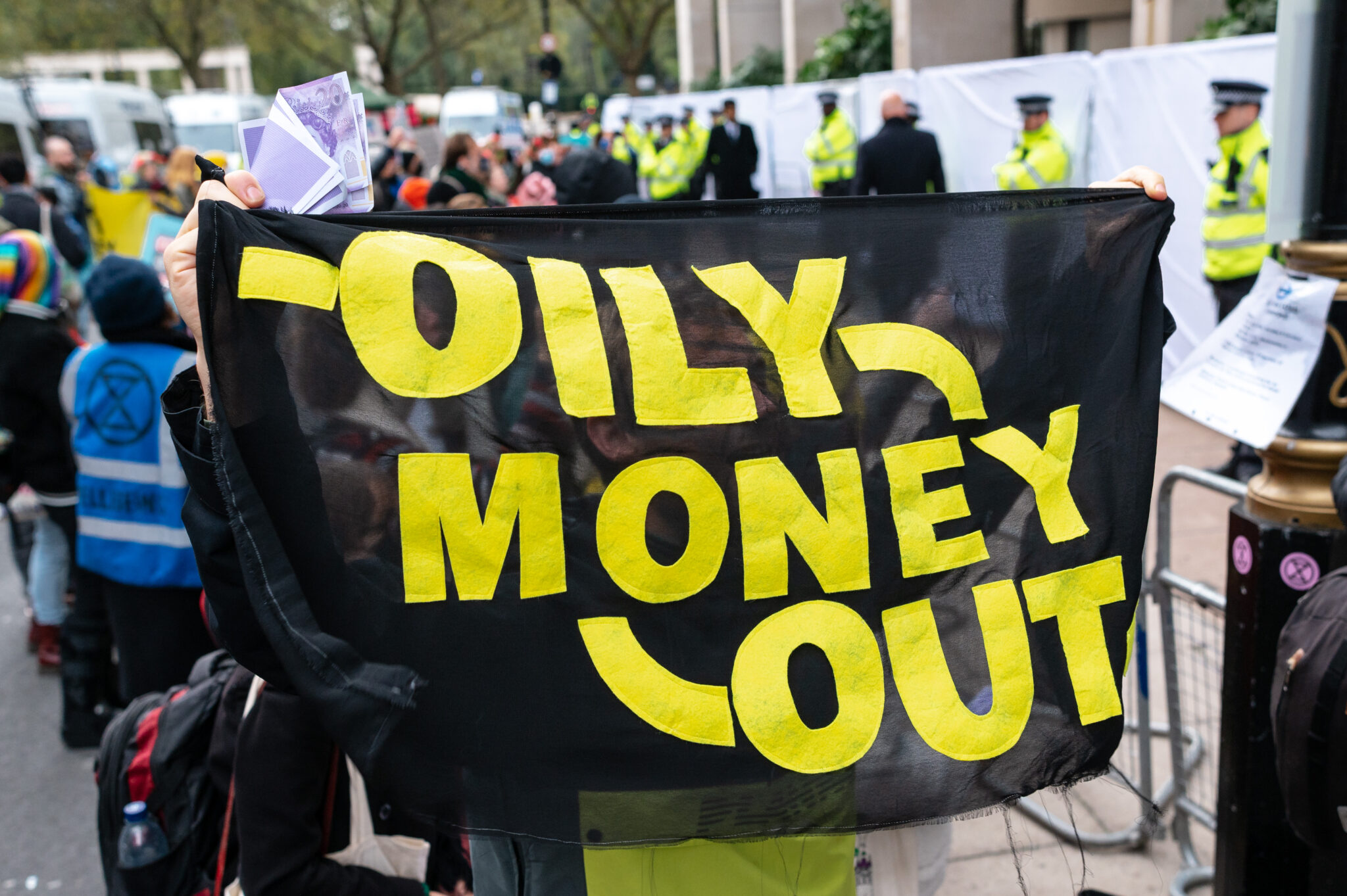 Banner reads Oily Money Out. Protests London 18 October 2023.