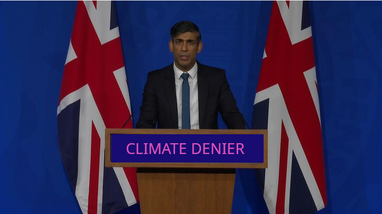Rishi Sunak podium reads CLIMATE DENIER